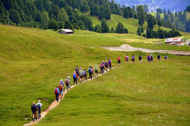 A group of people hiking on a mountain trail, signifying adventure expeditions.